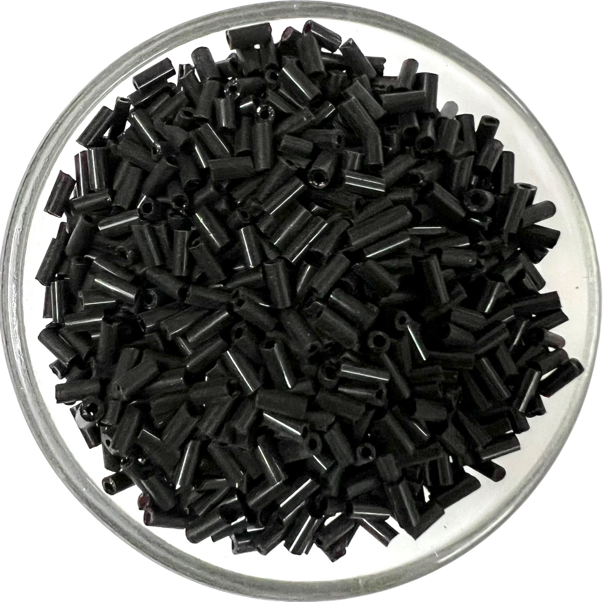 Loose metallic black glass tube beads for DIY jewelry making on a white background.