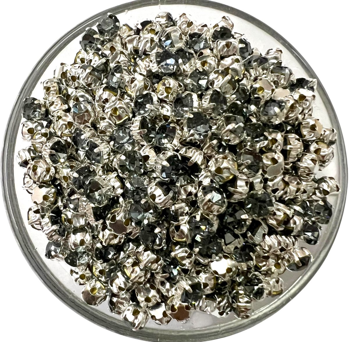 Sparkling grey 3mm round clip stones with a secure metal setting, ideal for intricate Aari embroidery, garment embellishment, and jewelry making.