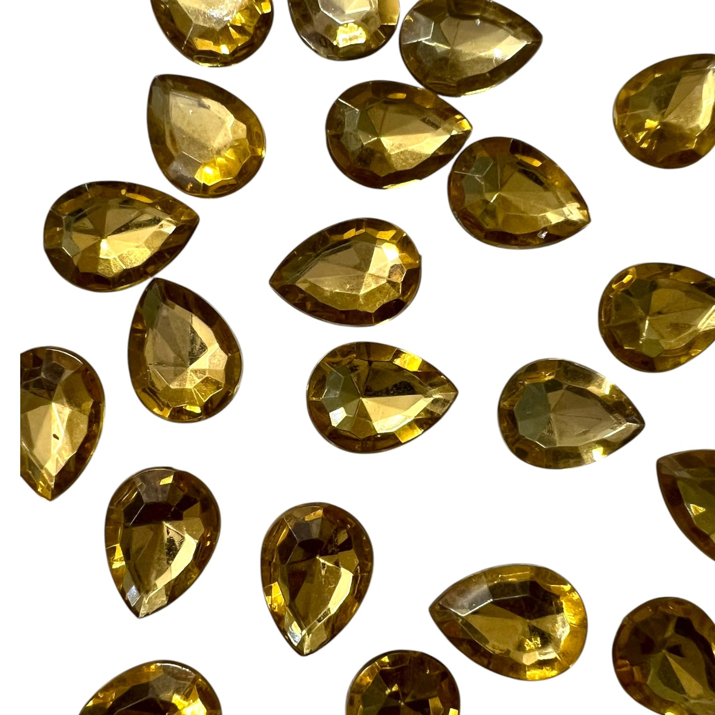 Pack of faceted golden 10x14mm oval acrylic stone beads with shiny crystal-cut edges for jewelry making and craft projects
