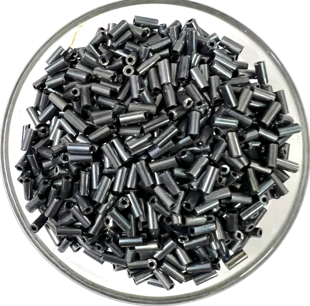 Loose metallic mercury glass tube beads for DIY jewelry making on a white background