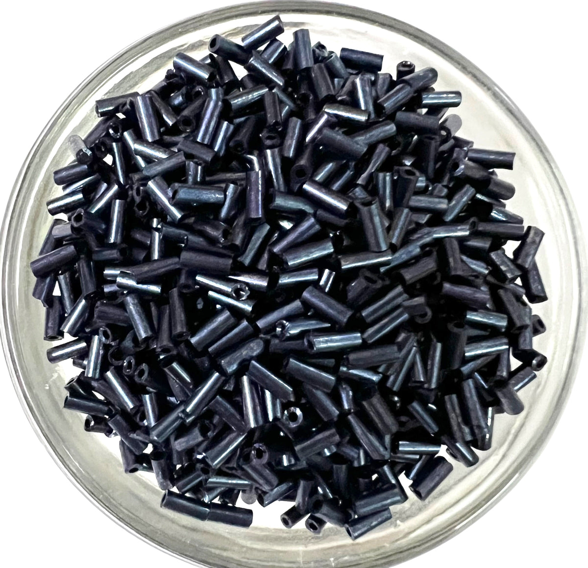 Loose metallic steel grey glass tube beads for DIY jewelry making on a white background.