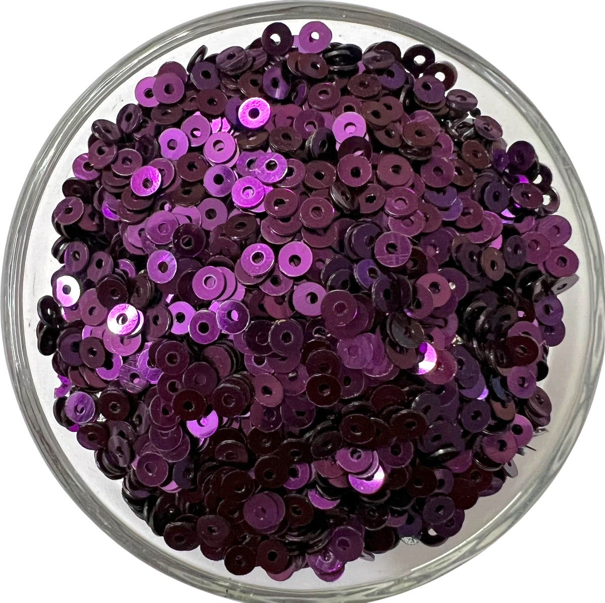 Close-up of 3mm dark purple metal sequins with a shiny metallic finish, perfect for intricate Aari embroidery, hand embroidery, and DIY jewelry making.
