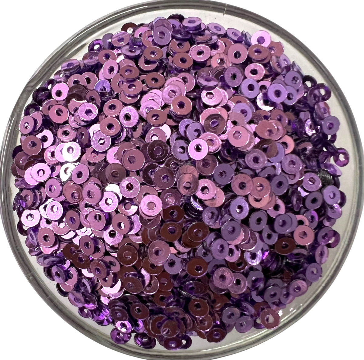 Close-up of 3mm light purple metal sequins with a shiny metallic finish, perfect for intricate Aari embroidery, hand embroidery, and DIY jewelry making.