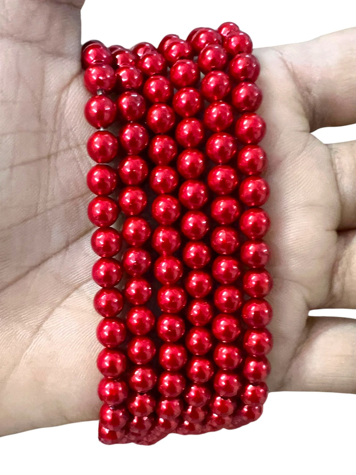 Vibrant red 6mm moti beads with a smooth glossy finish, ideal for traditional Aari embroidery, fabric embellishment, and handmade jewelry making.