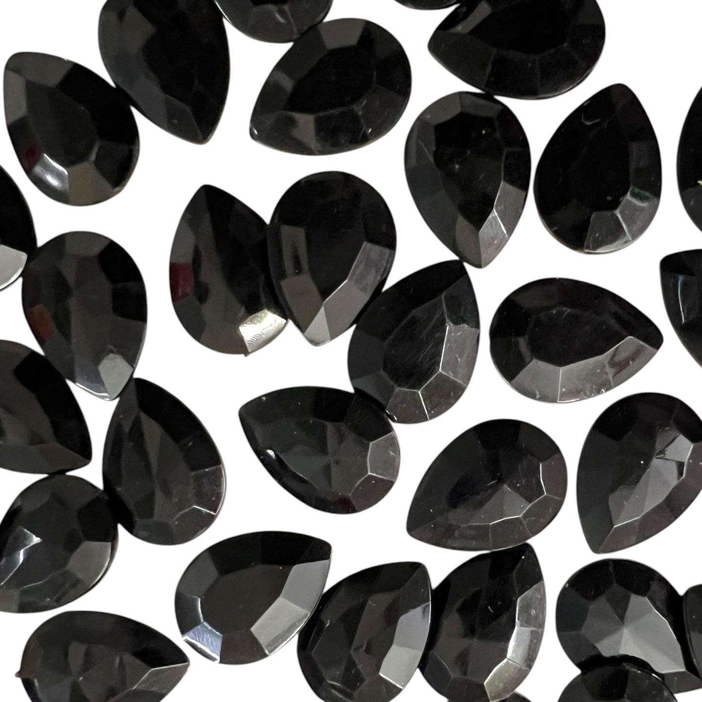 Pack of faceted black 10x14mm oval acrylic stone beads with shiny crystal-cut edges for jewelry making and craft projects
