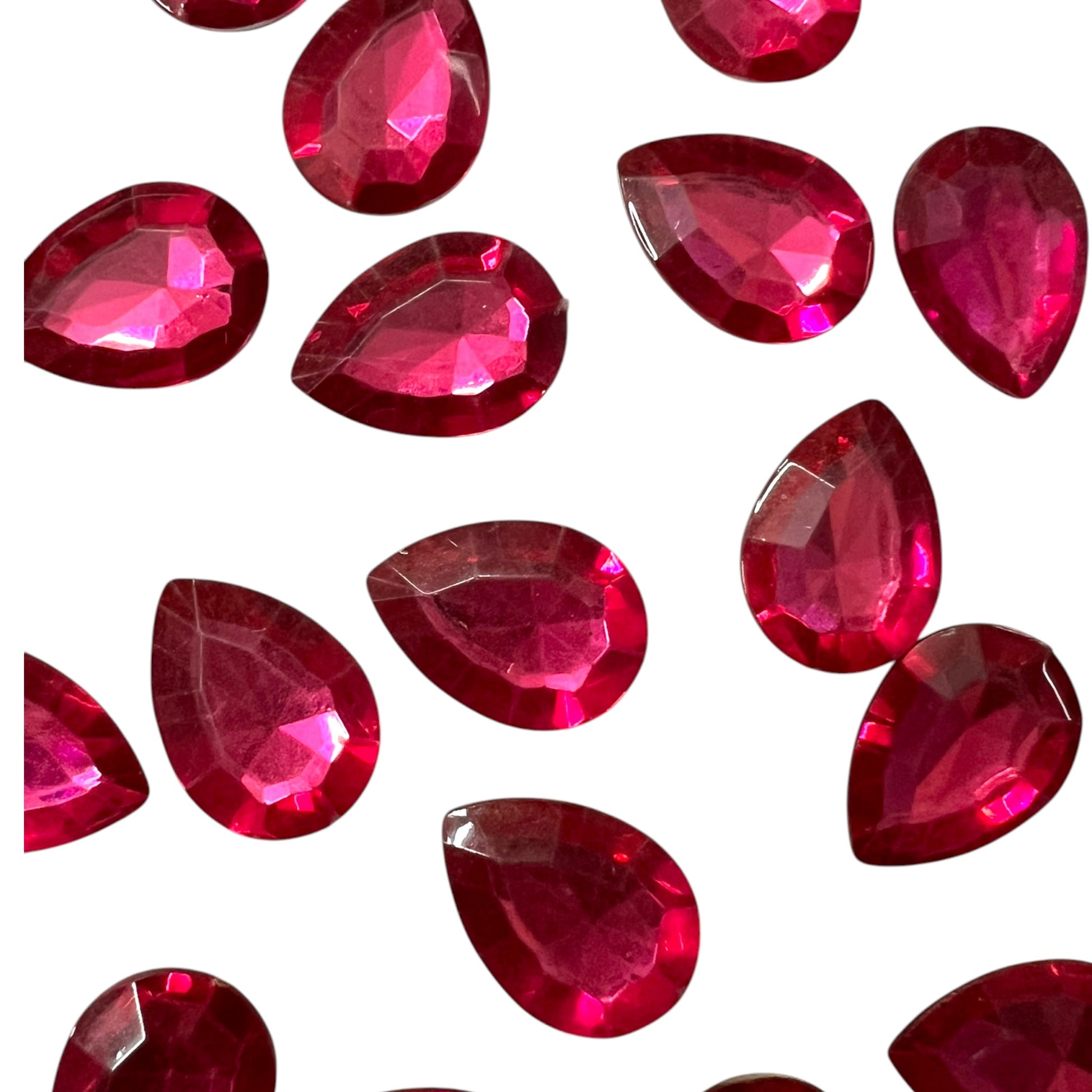 Pack of faceted pink 10x14mm oval acrylic stone beads with shiny crystal-cut edges for jewelry making and craft projects