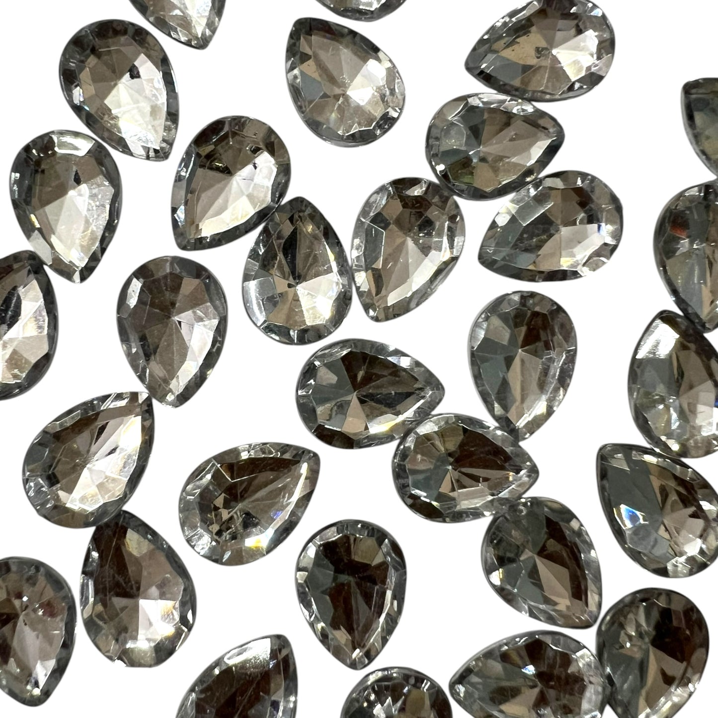 Pack of faceted white 10x14mm oval acrylic stone beads with shiny crystal-cut edges for jewelry making and craft projects