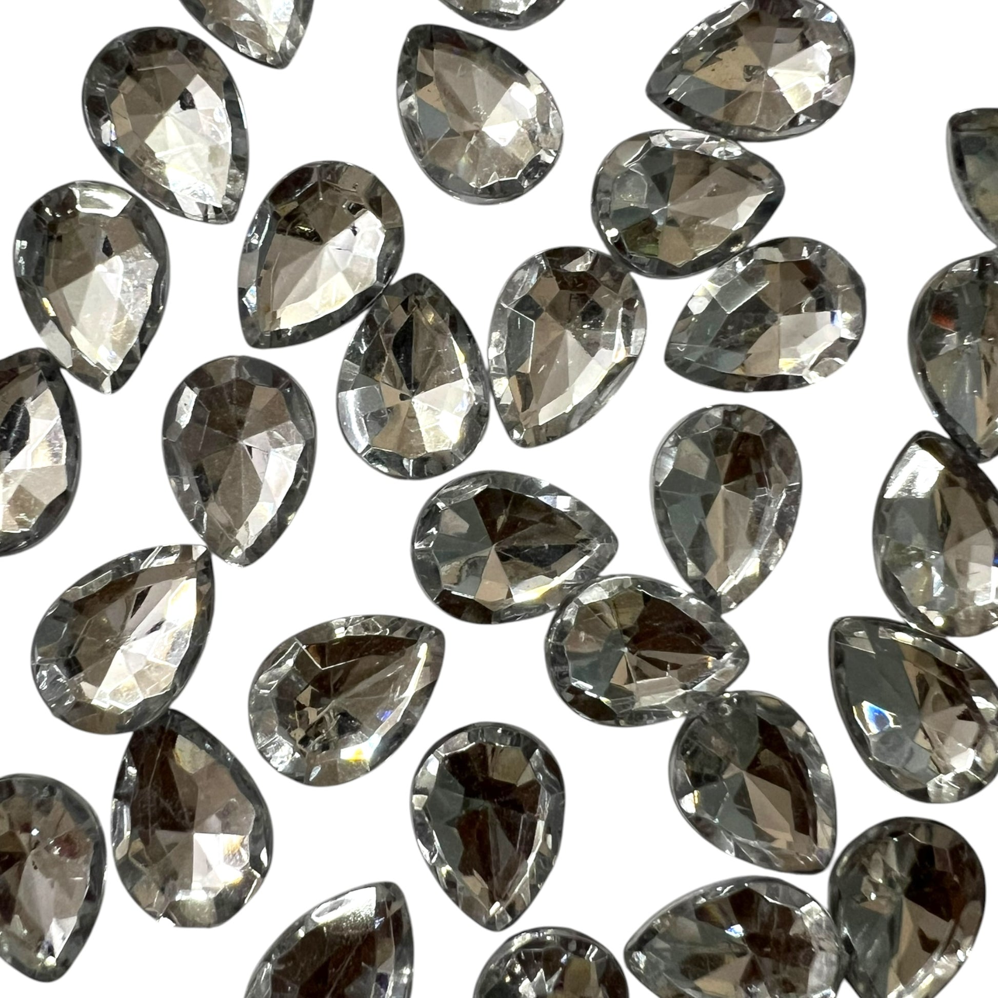 Pack of faceted white 10x14mm oval acrylic stone beads with shiny crystal-cut edges for jewelry making and craft projects